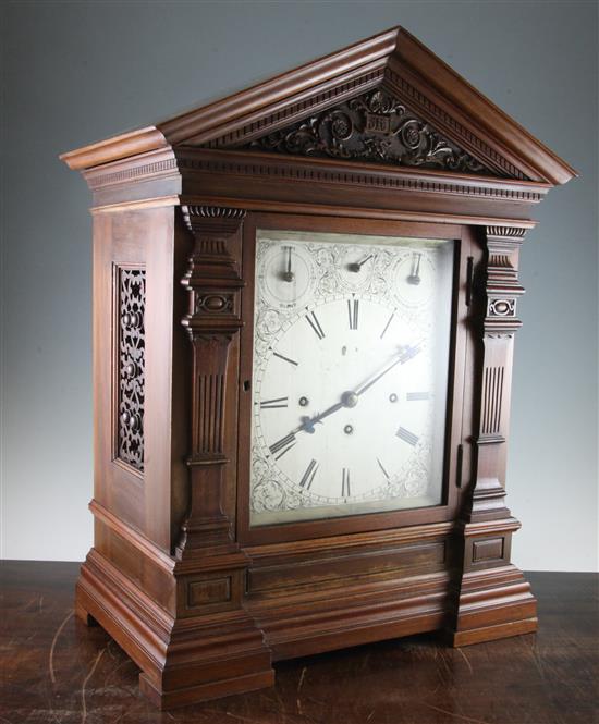 An Edwardian walnut chiming bracket clock, overall height 38in.